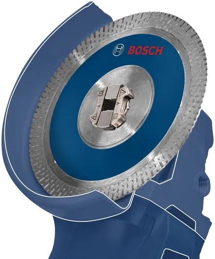 원형 톱날이 부착된 파란색 각도 그라인더의 클로즈업.